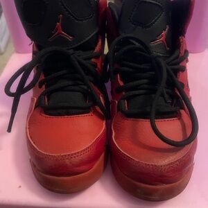 Kids Red and Black Jordan sneakers